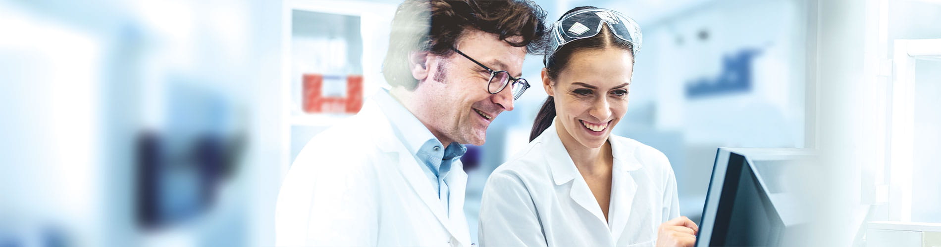 Two scientists talking smiling